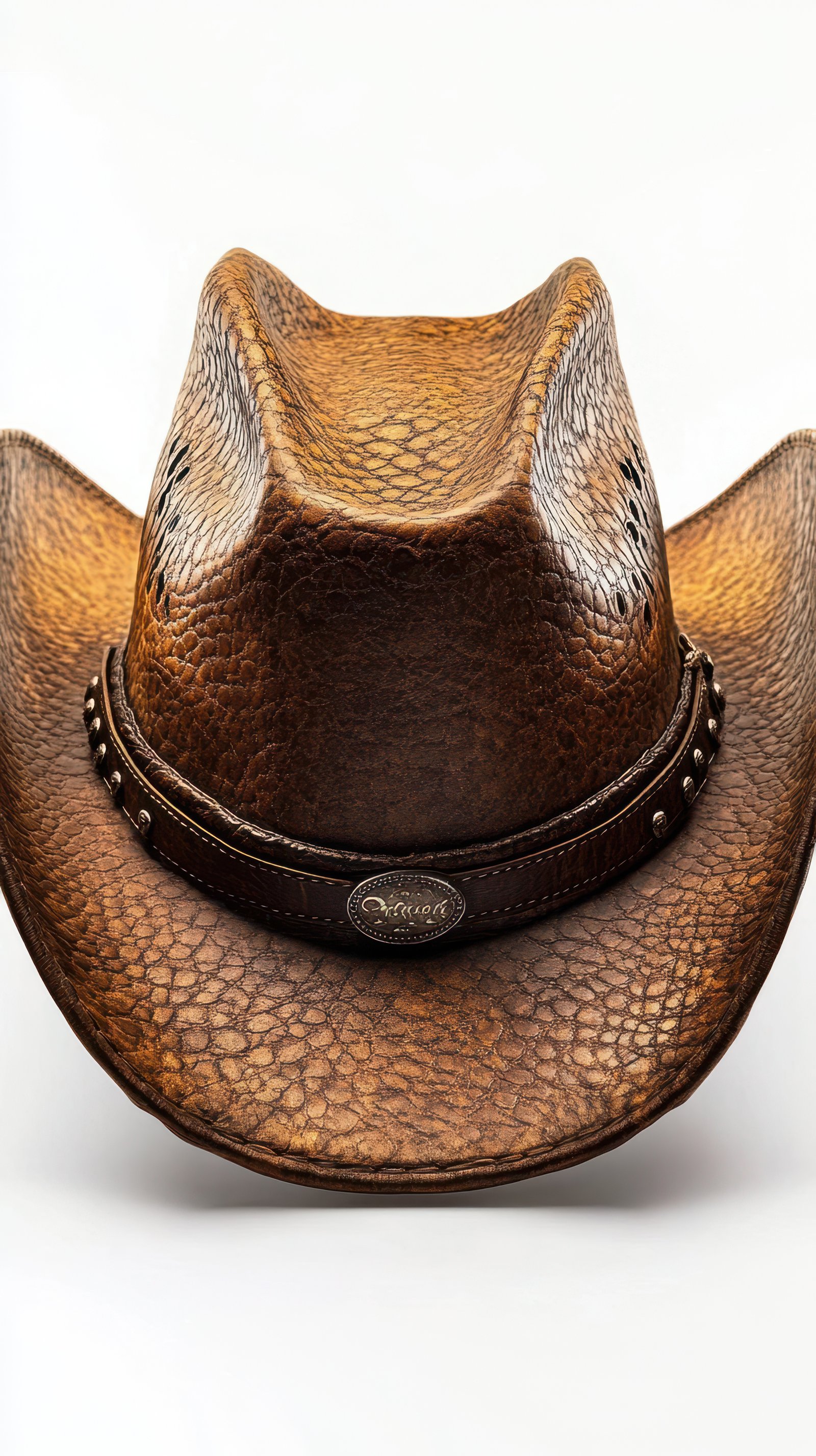 Rustic brown cowboy hat with detailed texture and band displayed against a neutral background